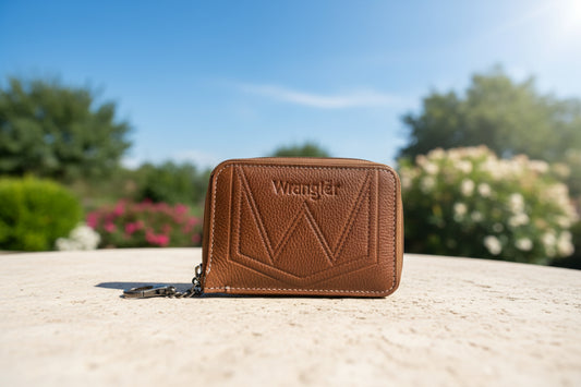 Brown leather wallet with 'Wrangler' branding on a white background