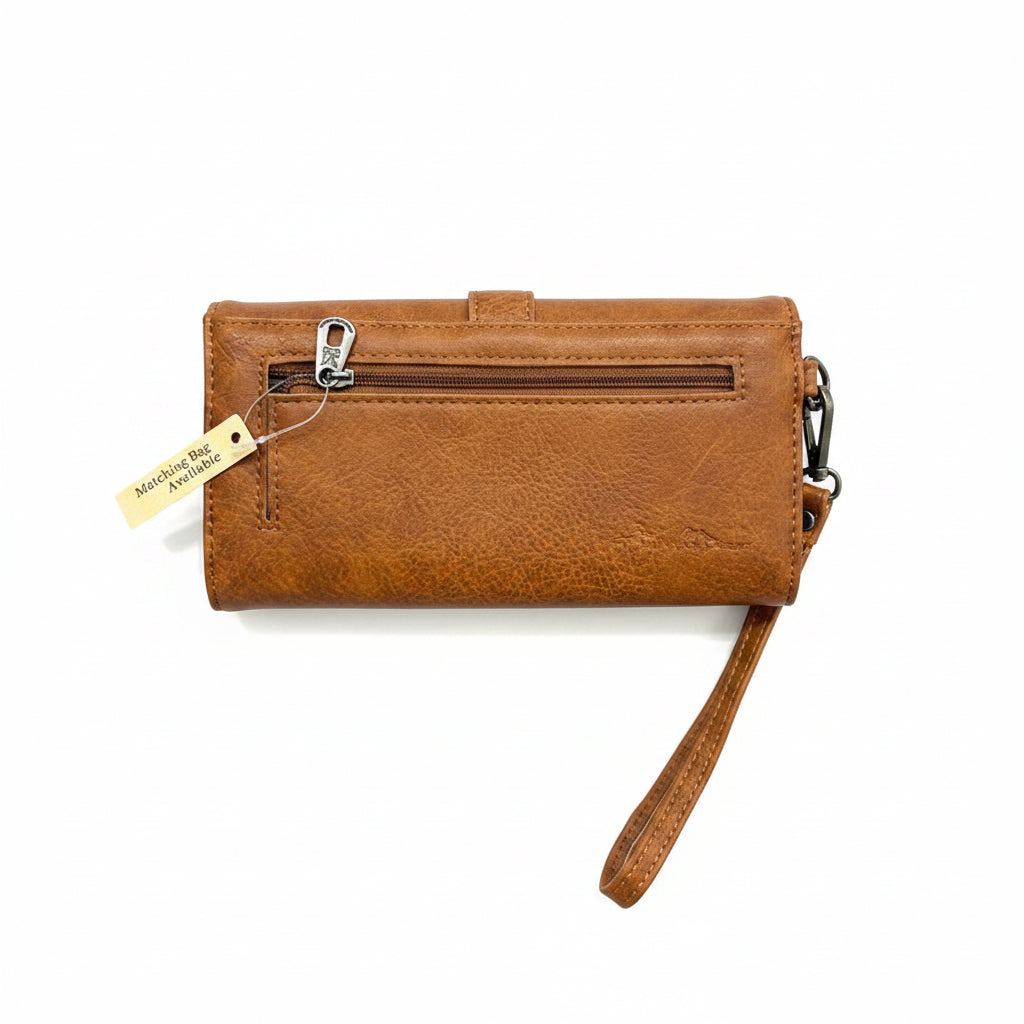 A textured cognac brown faux-leather wristlet wallet with a top zipper, metal clasp, and matching wrist strap