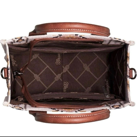 Open aztec cream wrangler bag with visible stitching on a white background