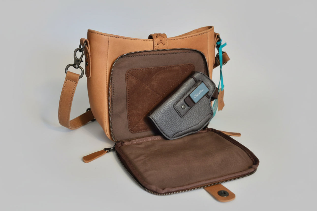 Open brown leather bag with a conceal carry back