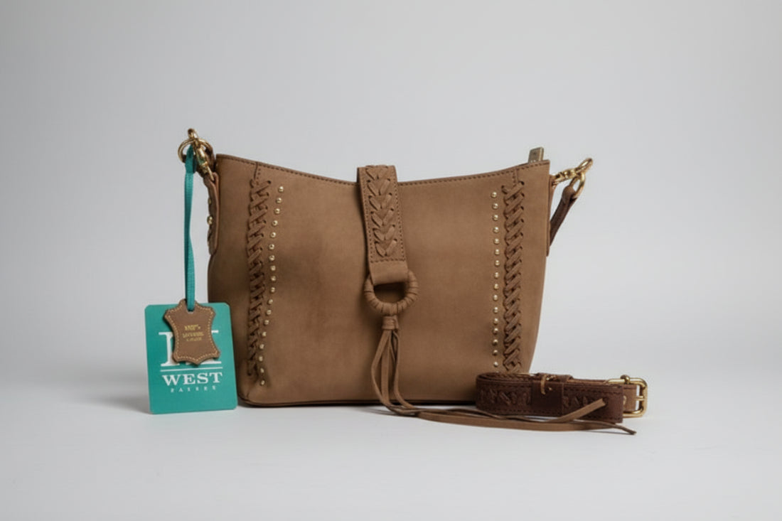 Brown leather handbag with braided details on a white surface, with a West tag visible.