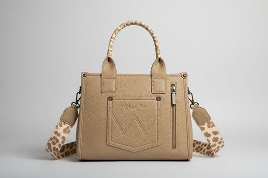 Beige handbag with a leopard print strap on a white surface
