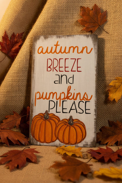 wood sign with autumn breeze and pumpkins please in fall decor