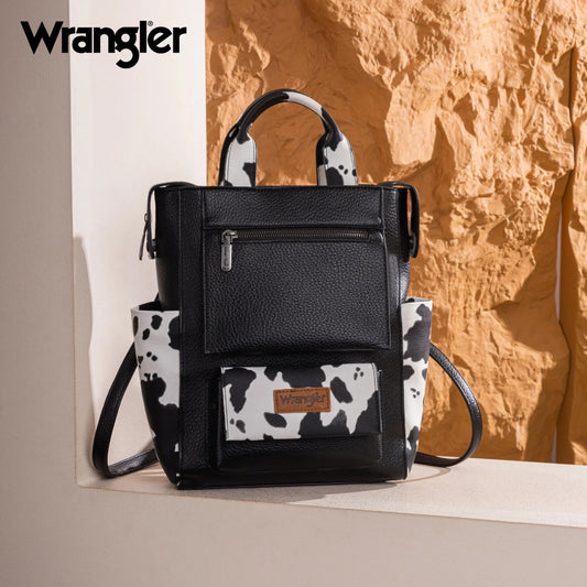 Black backpack with cow print accents and Wrangler logo on a neutral background