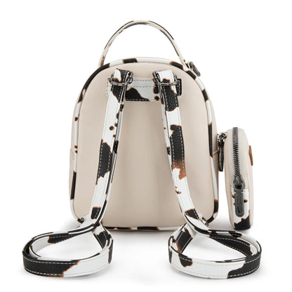 Beige backpack with black and white cow pattern trim on a white background