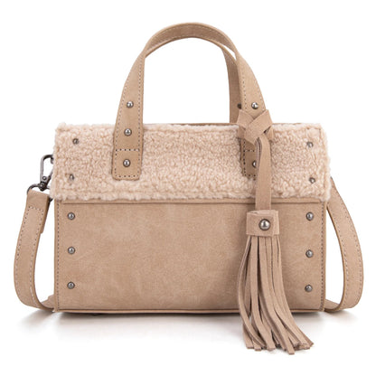 Beige handbag with shearling liner and tassel on a white background