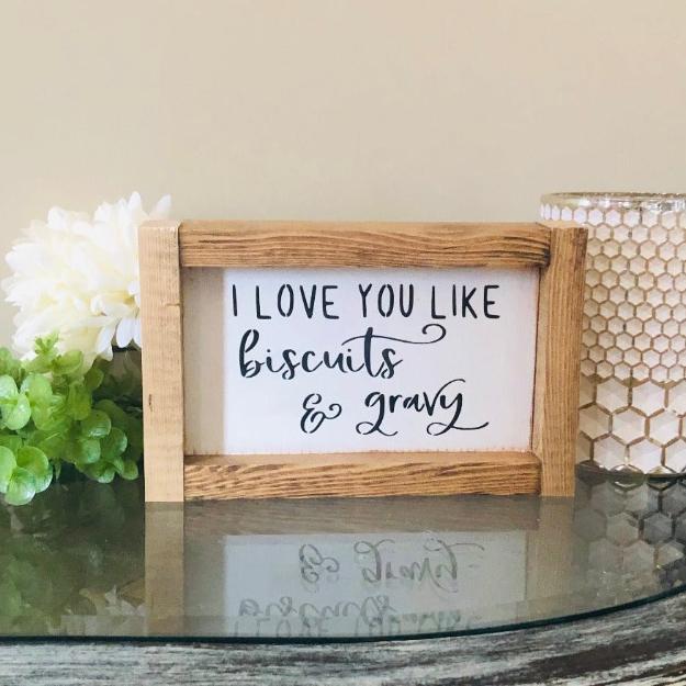 i love you like biscuits & gravy farmhouse sign white with black lettering