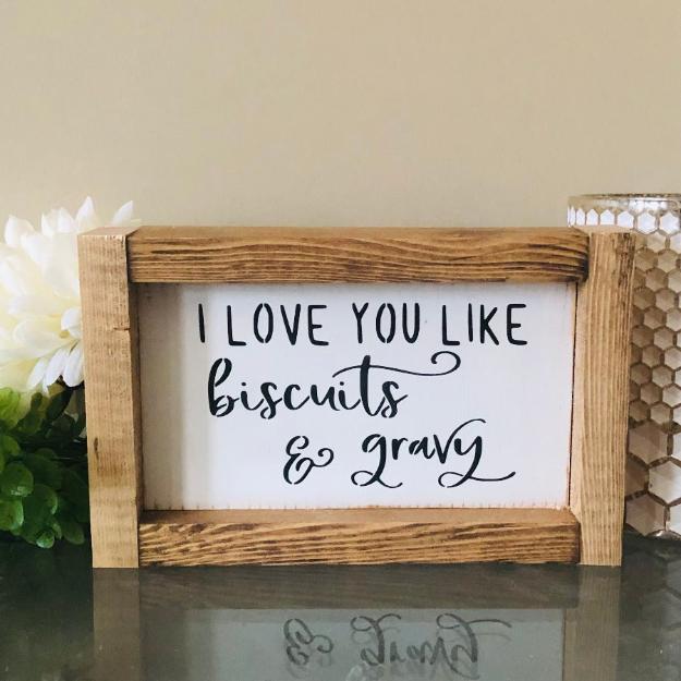 i love you like biscuits & gravy farmhouse sign white with black lettering