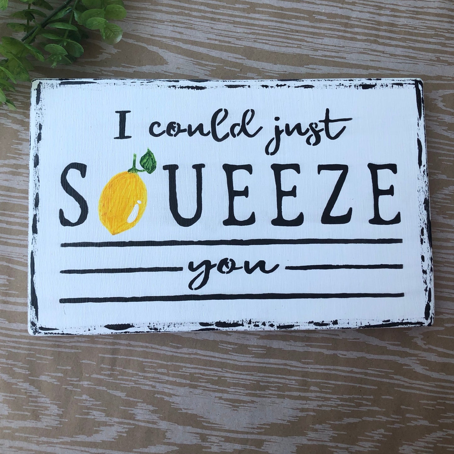 I could just squeeze you with lemon on white sign with black lettering